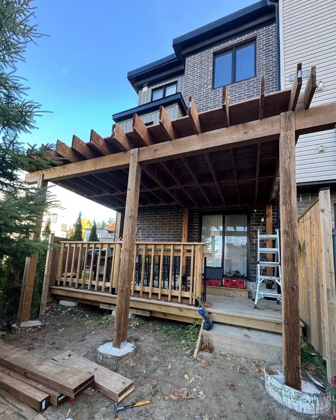 Rear deck and pergola framed in pressure-treated lumber, Barrie