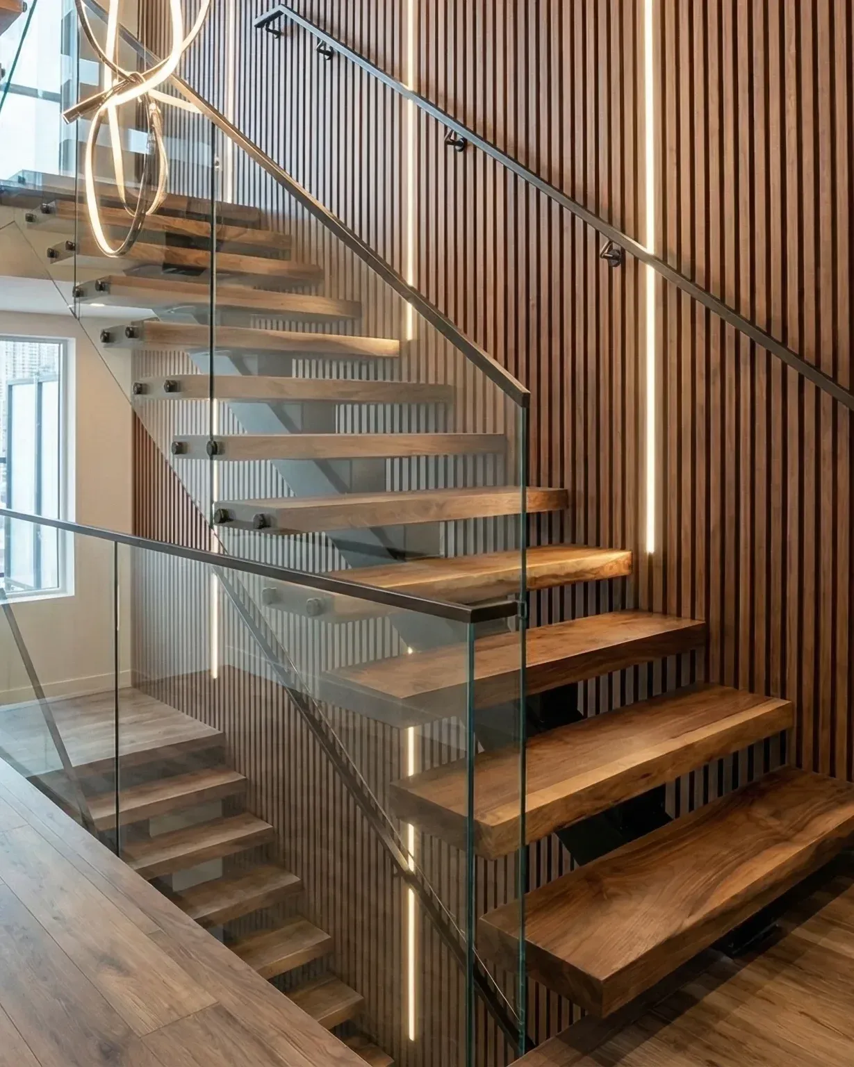 Floating oak stair with a frameless glass guard