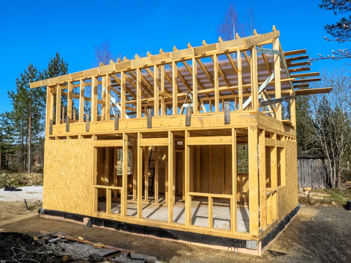 Two-storey timber-frame addition sheathed and framed on site