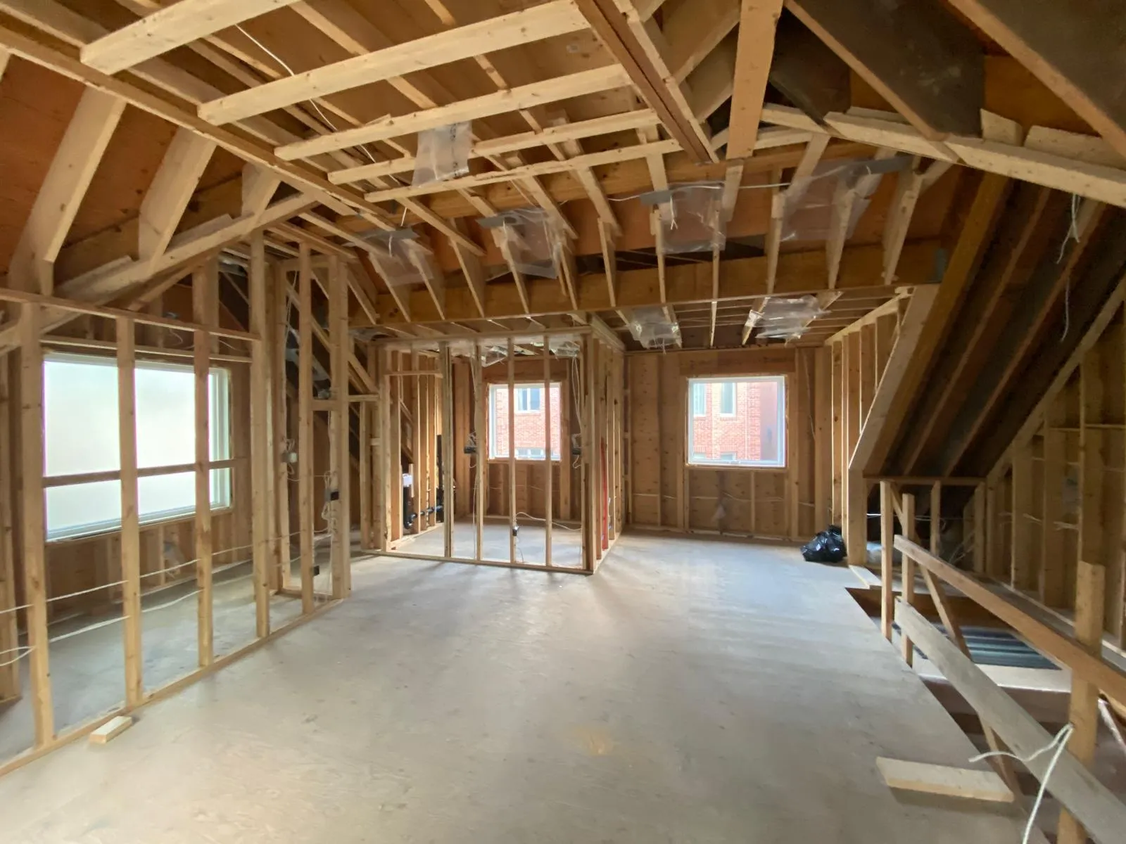 Two-storey garden suite framing under construction in a Toronto backyard